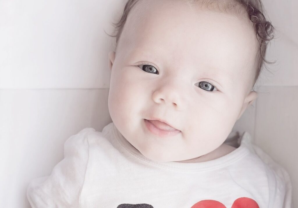 when do babies first smile